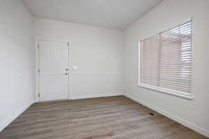 Spare room with light hardwood / wood-style floors