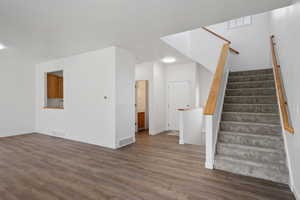 Interior space with dark hardwood / wood-style floors