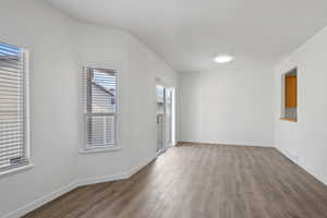 Spare room featuring hardwood / wood-style flooring