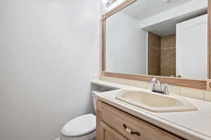 Bathroom with vanity and toilet