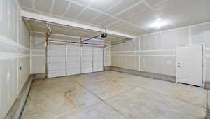 Garage featuring a garage door opener