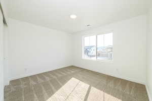 Spare room with carpet floors