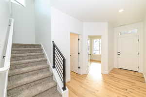 Foyer entrance featuring light hardwood / wood-style floors