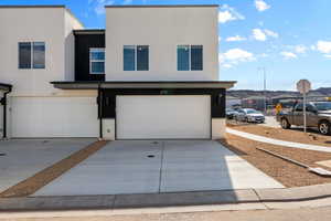 View of front of property featuring a garage