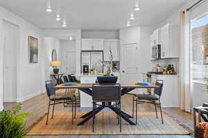 Dining area with light hardwood / wood-style floors