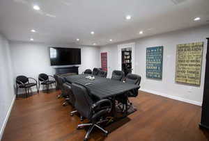 Office area with dark hardwood / wood-style floors