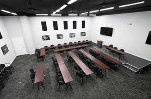 Interior space featuring dark colored carpet