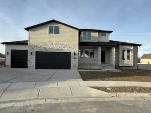 View of front of property featuring a garage