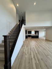 Stairway featuring hardwood / wood-style flooring