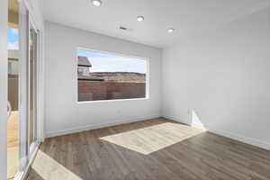 Empty room featuring wood-type flooring