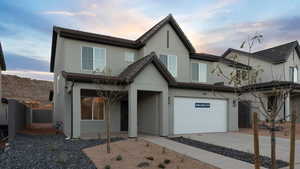 View of front of property with a garage