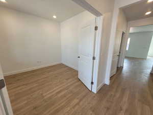 Hallway with dark wood-type flooring