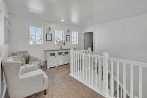 Interior space featuring a crib and a textured ceiling