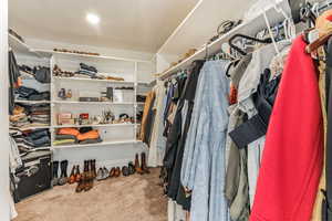 Walk in closet featuring carpet flooring