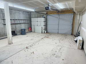 Garage featuring a garage door opener