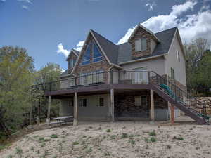 Rear view of property featuring a large deck