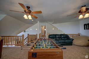 Rec room with ceiling fan, carpet, and a textured ceiling