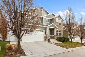 Craftsman-style home featuring a garage