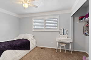 Bedroom featuring carpet flooring and ceiling fan