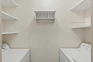 Laundry room featuring separate washer and dryer