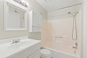 Full bathroom featuring  shower combination, toilet, and vanity