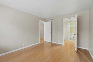 Unfurnished bedroom featuring light wood-type flooring