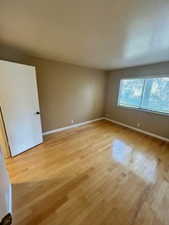 Unfurnished room with wood-type flooring