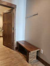 Extra bench and coat rack. View of mudroom