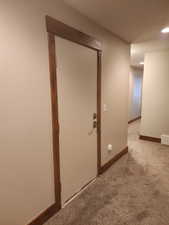 Owners Closet/Storage, Hallway with carpet