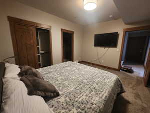 View of carpeted guest bedroom and bath