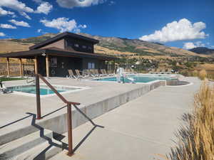 View of pool featuring a mountain view and a patio area