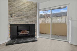 Interior space with hardwood / wood-style flooring and a fireplace