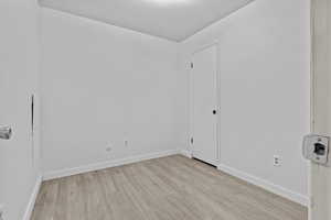 Spare room with light hardwood / wood-style flooring