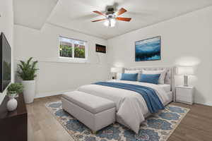 Bedroom featuring wood-type flooring and ceiling fan