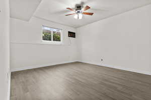 Spare room with ceiling fan and light hardwood / wood-style floors