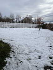 View of yard covered in snow