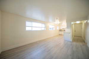 Unfurnished living room with light wood-type flooring