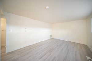 Unfurnished room with light wood-type flooring