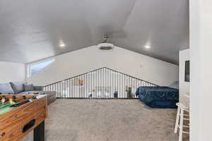 Loft that overlooks main floor kitchen and living room with fooseball table.