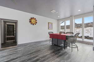 Dining room, adjacent to kitchen with mountain views to the west and lake views to the east and walkout to deck.