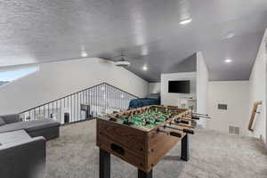 Loft that overlooks main floor kitchen and living room with fooseball table and exit to west facing deck.