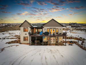 Property featuring french doors, hot tub, deck and porch.