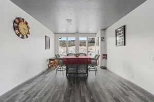 Dining room, adjacent to kitchen with mountain views to the west and lake views to the east and walkout to deck.