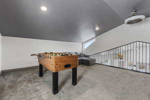 Loft that overlooks main floor kitchen and living room with fooseball table.