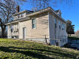 View of home's exterior featuring a yard