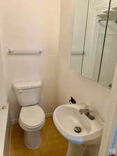 Bathroom featuring toilet and sink