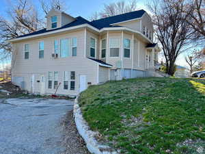 View of front of house with cooling unit