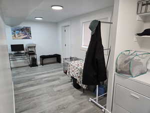 Interior space with light hardwood / wood-style floors and washer / clothes dryer