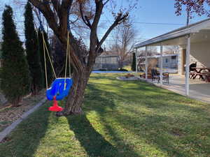 View of yard with a patio area