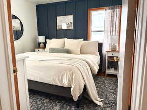 Bedroom featuring hardwood flooring